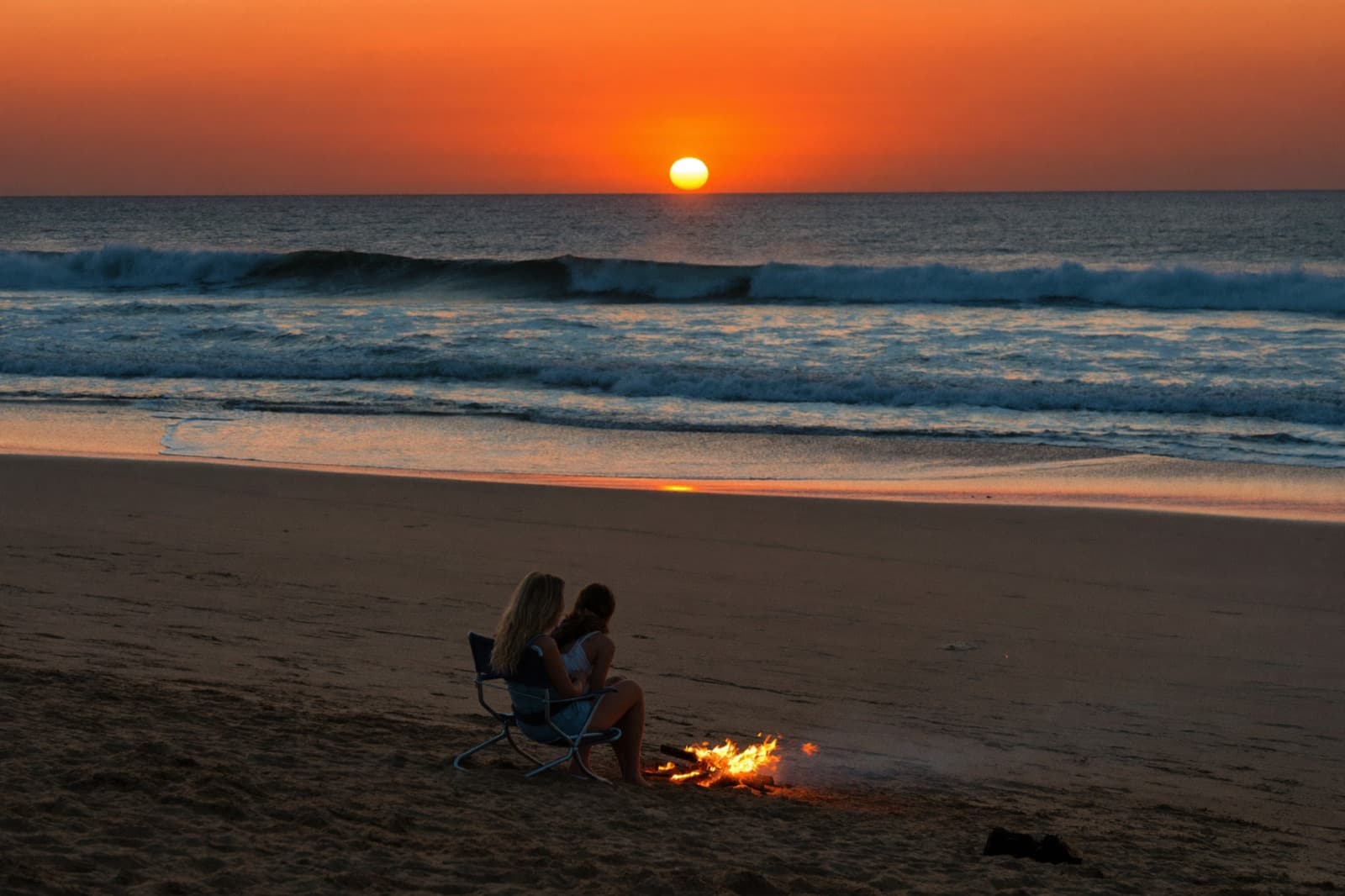 Beach bonfire at sunset