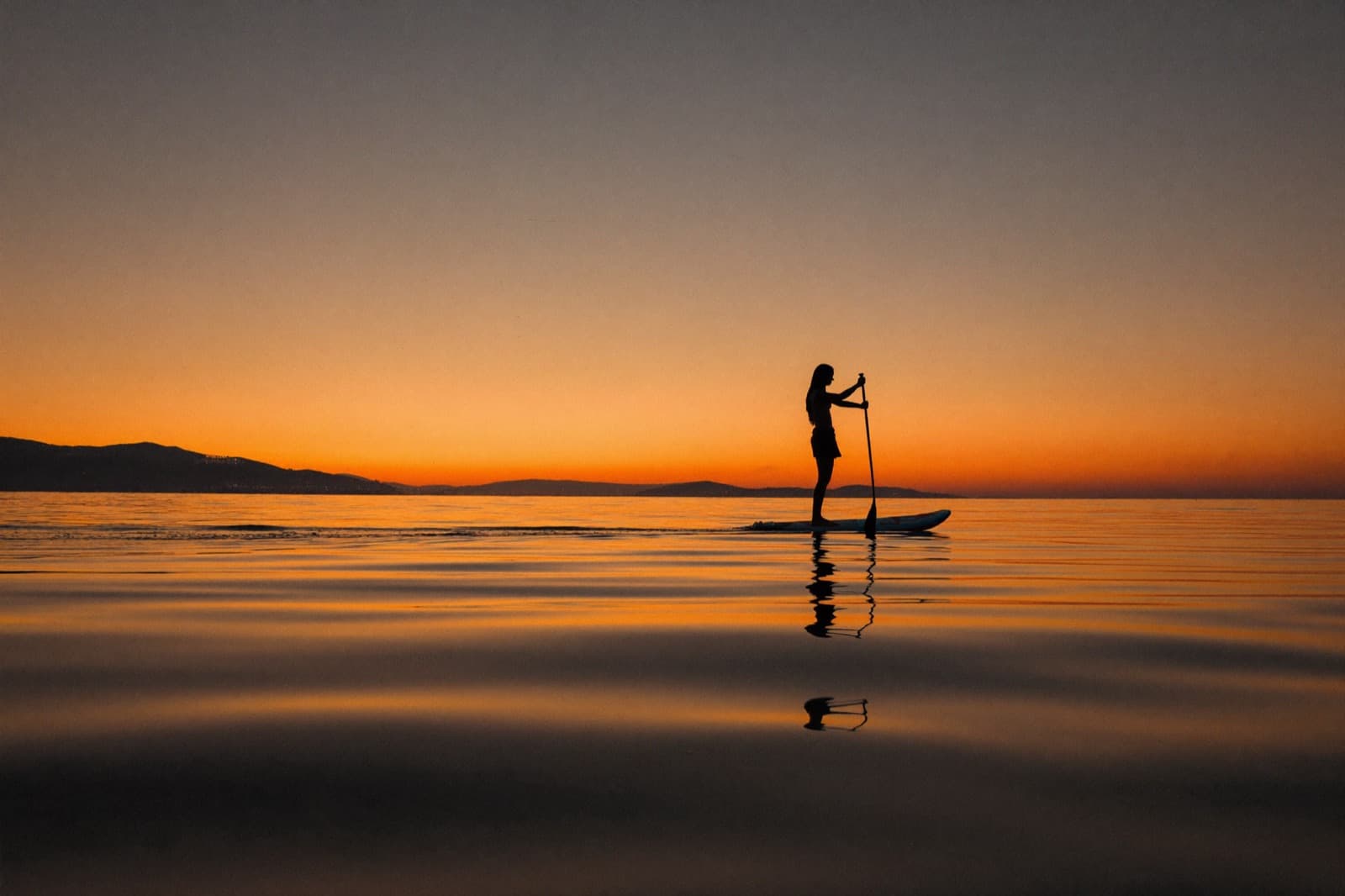 Sunset paddleboarding on Monterey Bay